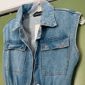 A full length denim jumpsuit with wide leg pants.